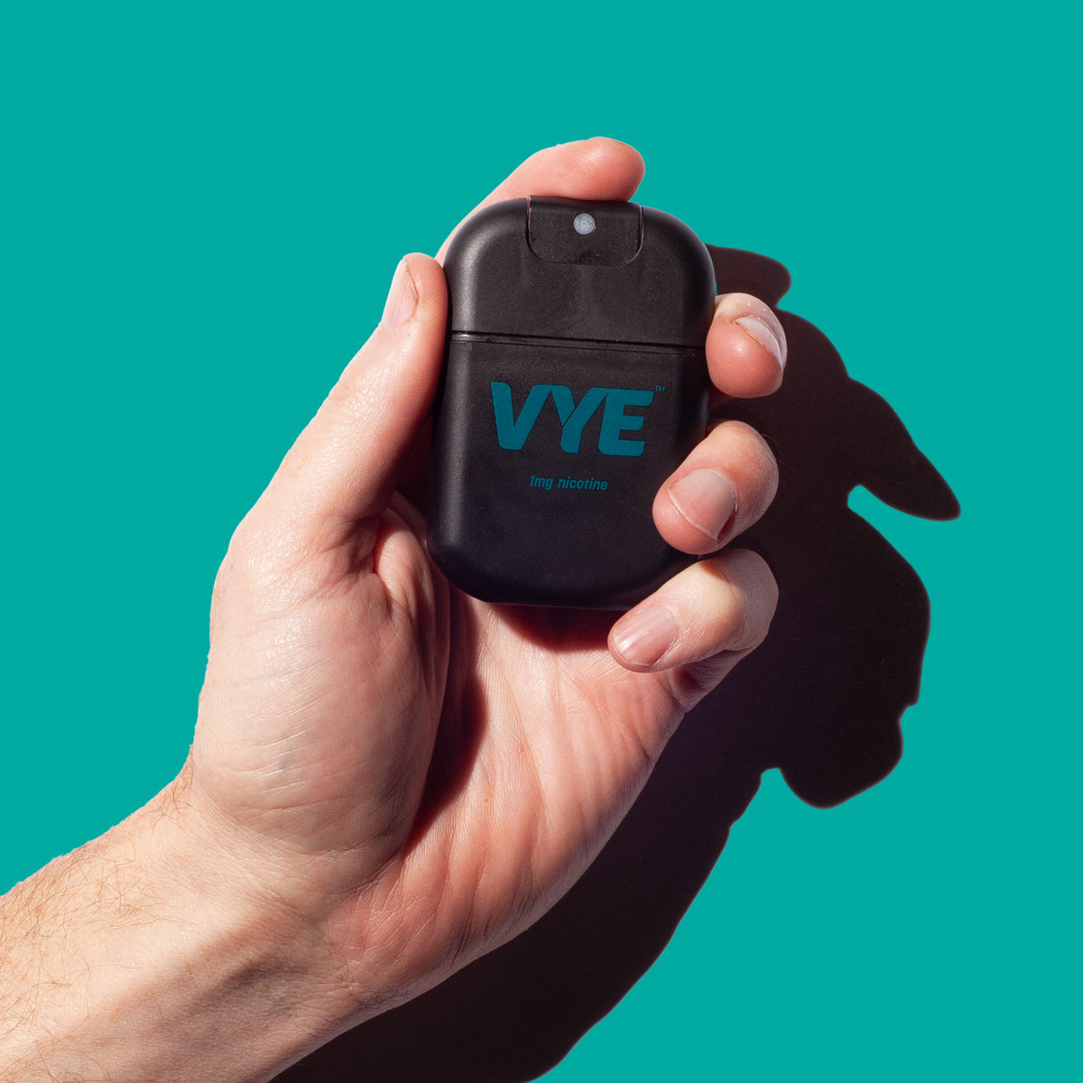 Hand holding a black VYE sprayer against a teal background, Mint flavour.