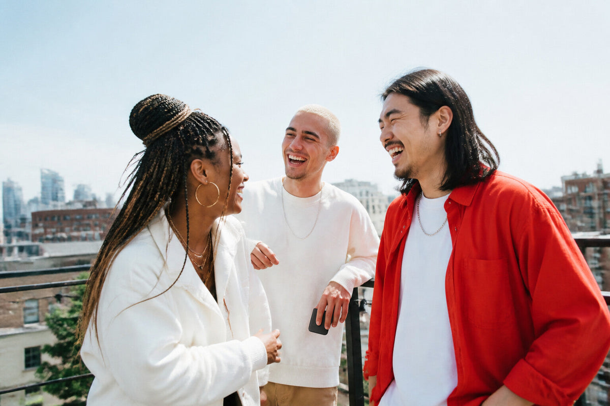 Three friends on a sunny rooftop, one holding a VYE sprayer.