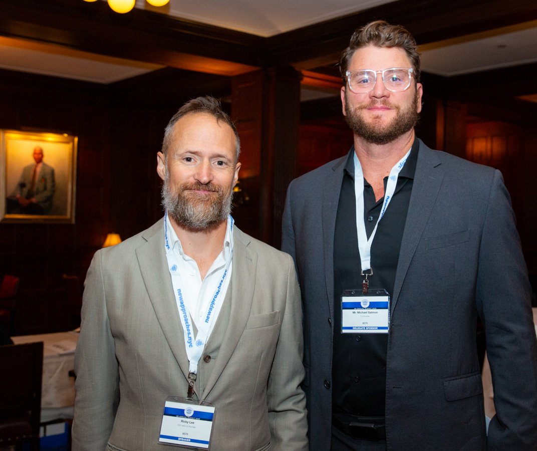 Ricky Lee, on the left, and Michael Salmon, on the right, smiling at the camera